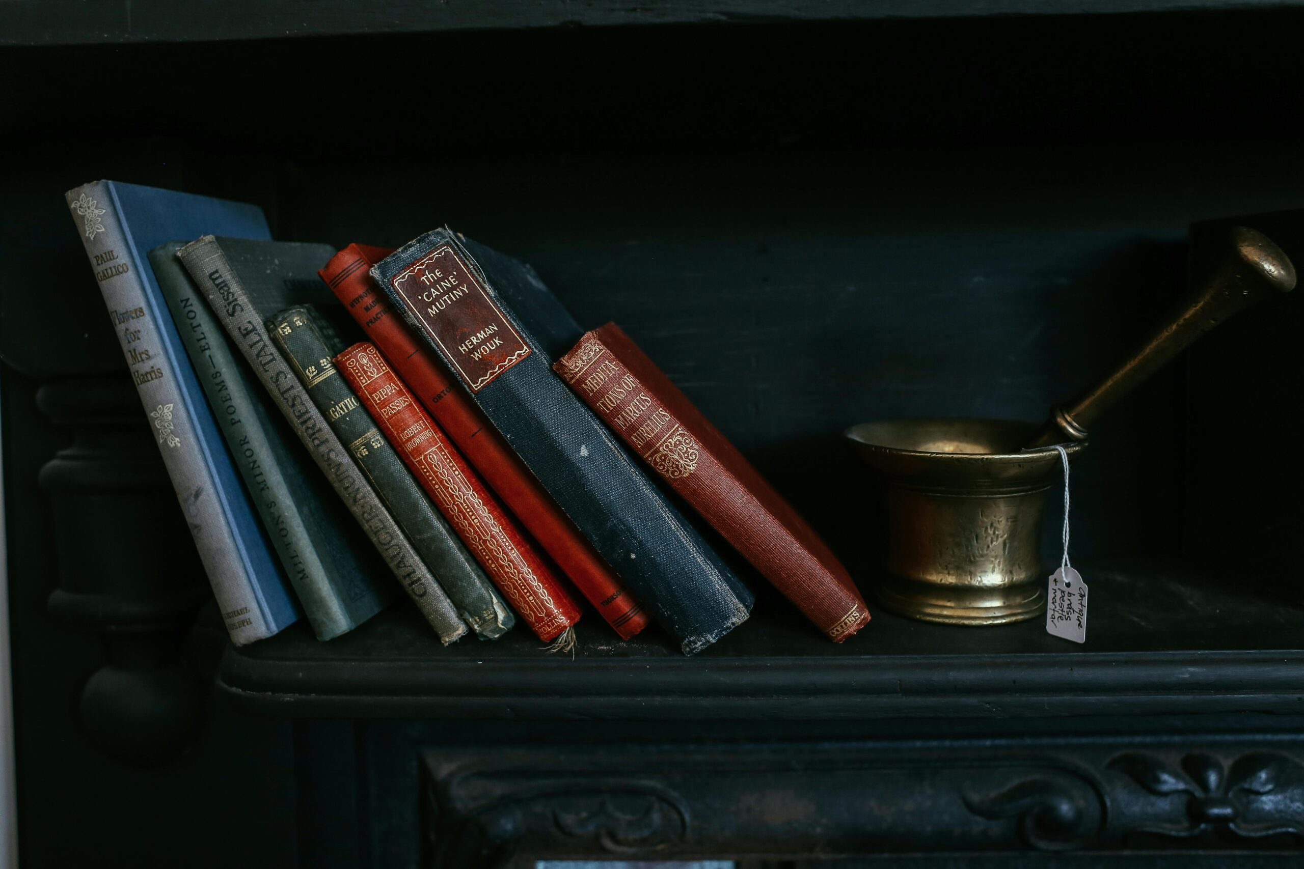 A cozy corner with books, candles, and no electronics in sight