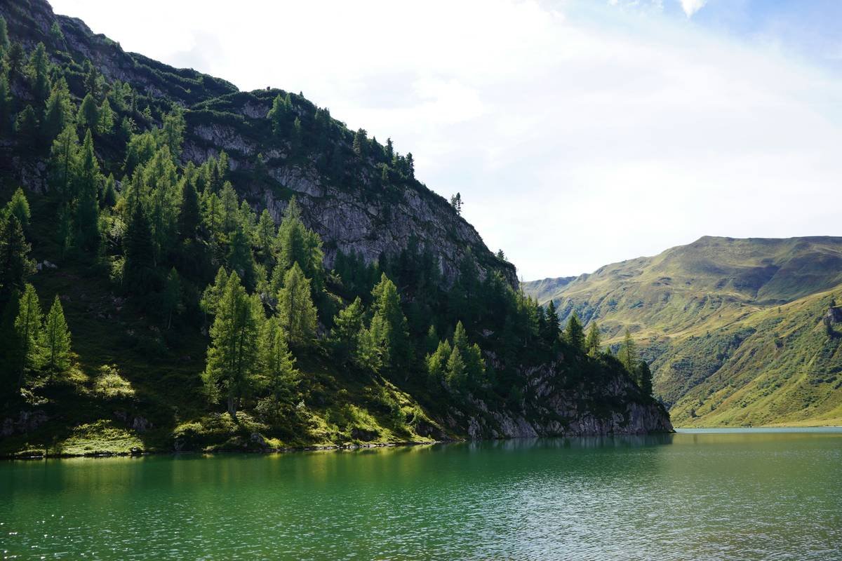 A cozy corner with a yoga mat, candles, and a plant for practicing mindfulness.