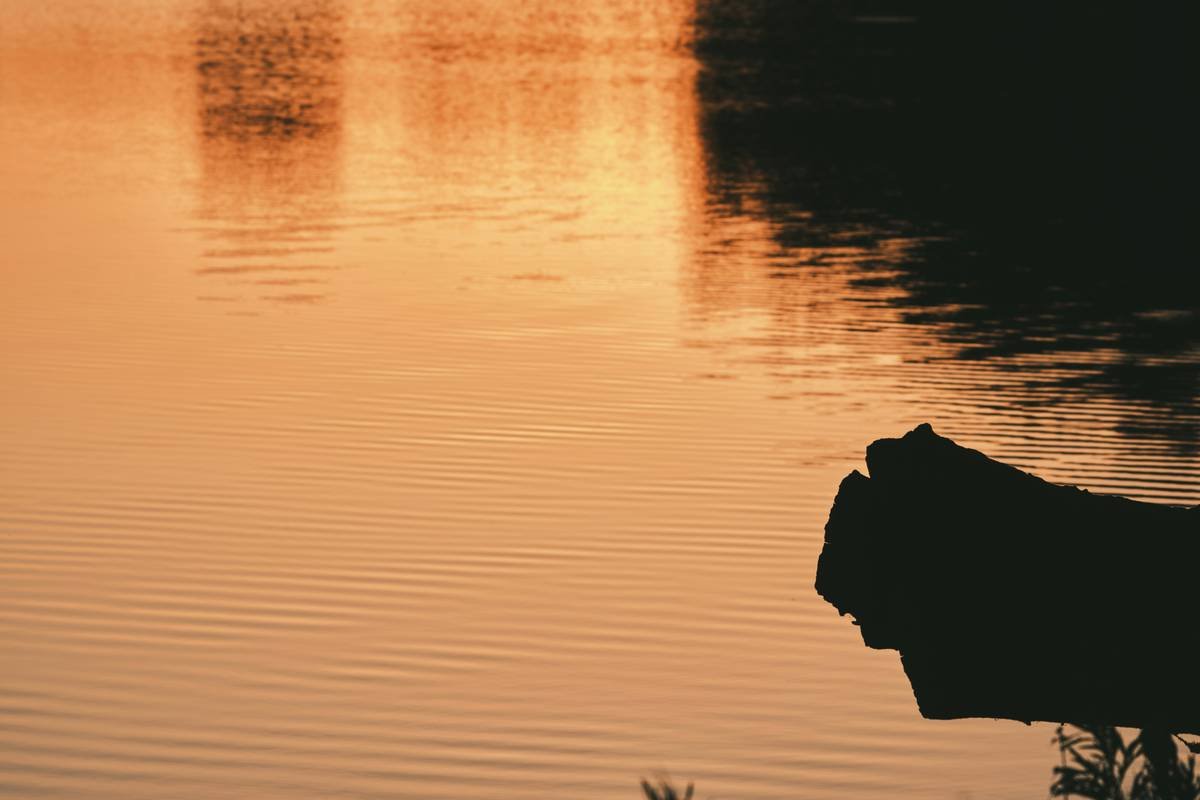 Person smiling peacefully after meditation session